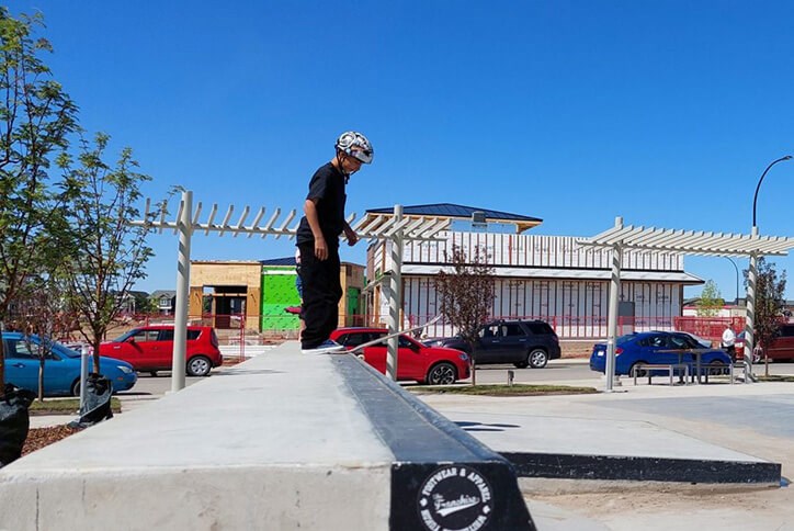 Seton community resident skateboarding in skatepark amenity in Calgary, Alberta